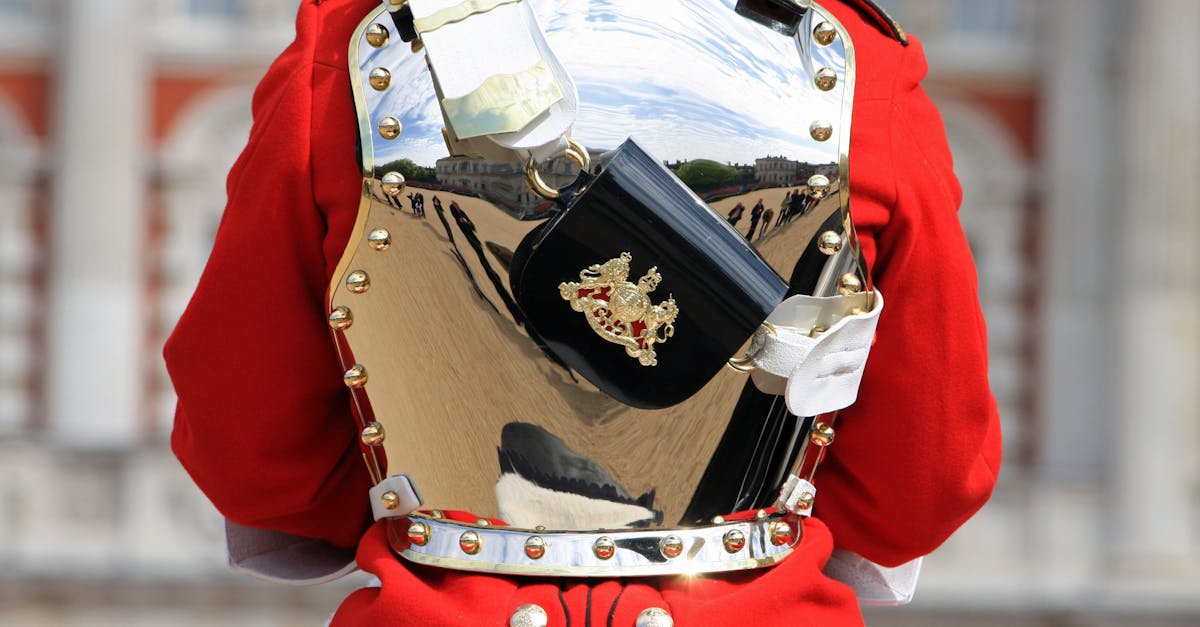 Close-up of a Household Cavalry soldier's polished breastplate reflecting surroundings.