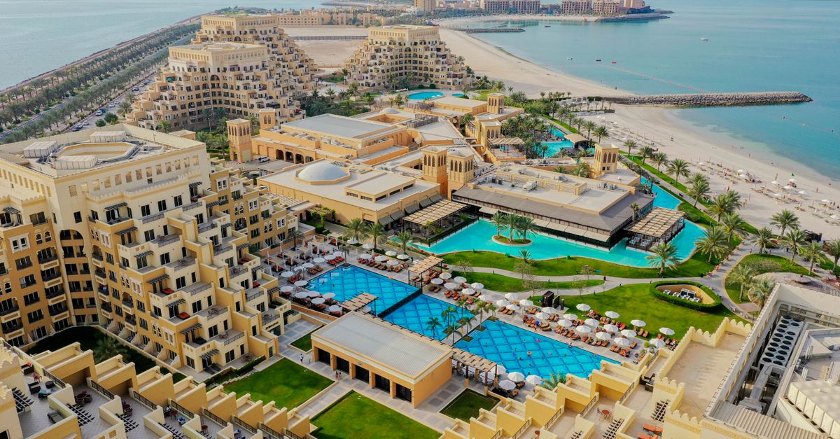Stunning aerial view of a luxury beach resort on Al Marjan Island, United Arab Emirates.
