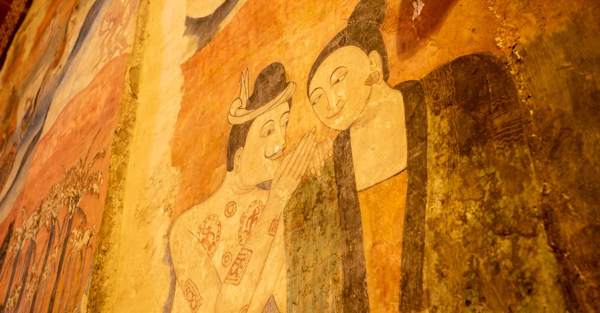 Aged mural fresco depicting two figures whispering, showcasing historical art style.