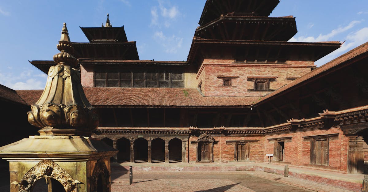 A beautiful courtyard featuring traditional pagoda-style architecture in a historic temple setting.