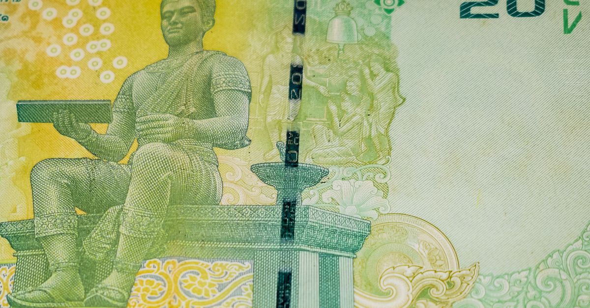Detailed view of a 20 Thai Baht banknote featuring an intricate sculpture design.