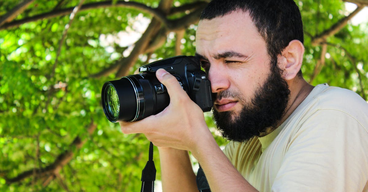 A dedicated photographer captures moments in nature using a DSLR camera.