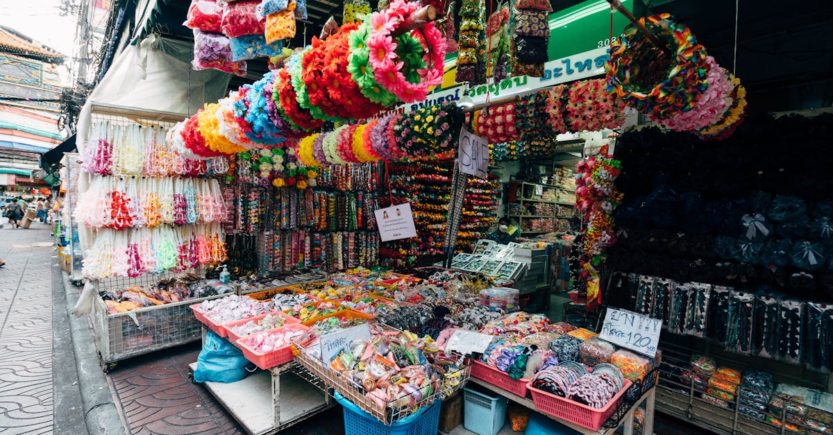 A bustling market stall filled with colorful accessories in a lively street setting.