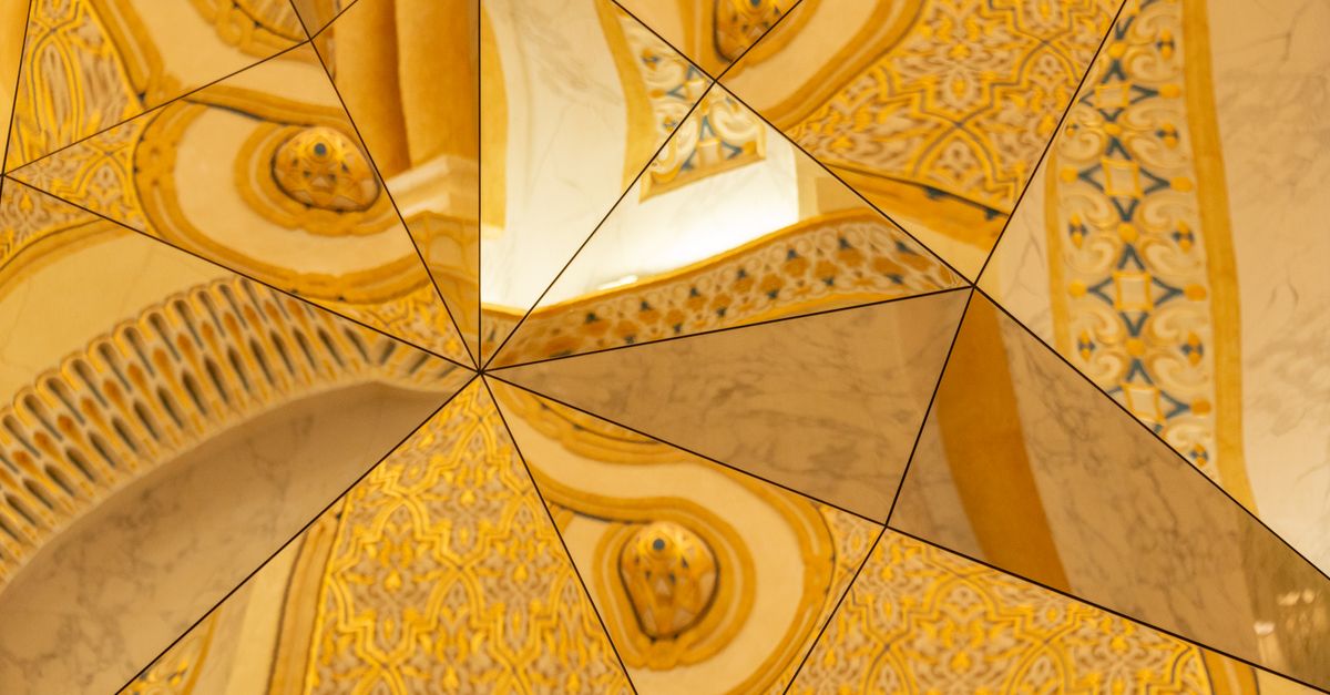Abstract reflection of decorative architecture with golden geometric patterns and artistic designs.