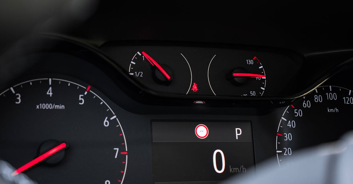 Detailed view of a car's dashboard showing speedometer, tachometer, and control meters.