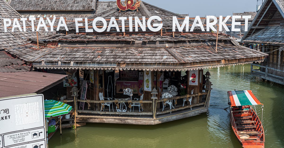 Historic Pattaya Floating Market featuring traditional Thai architecture and colorful boats.