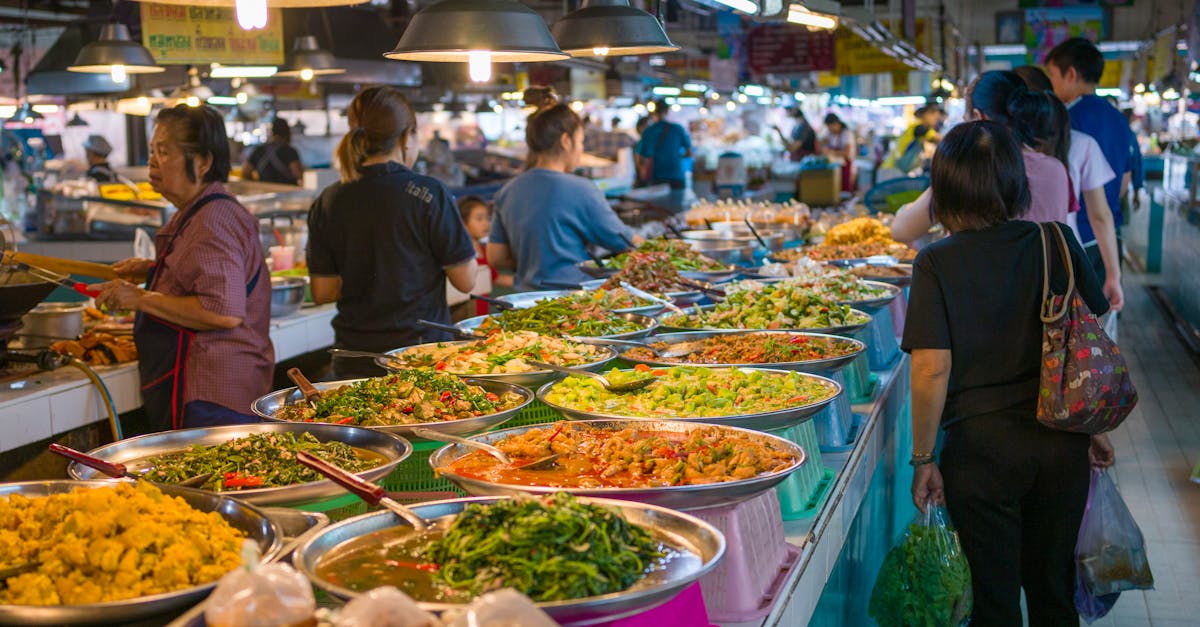 Explore the bustling atmosphere of a Bangkok street market with colorful Thai cuisine.