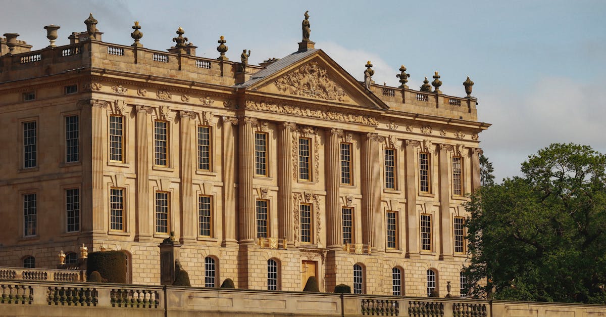 A grand historic mansion featuring classic architecture, likely located in the United Kingdom.