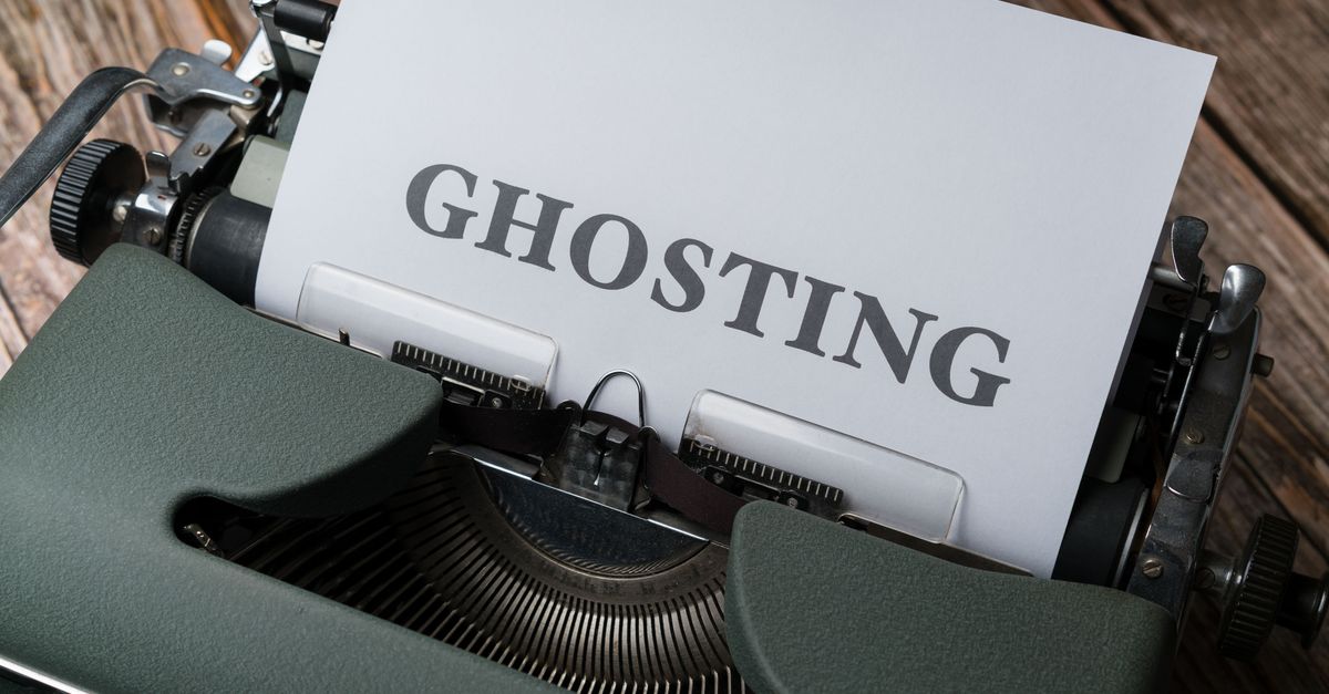 Vintage typewriter displaying the word 'ghosting' on a paper sheet symbolizing communication issues.