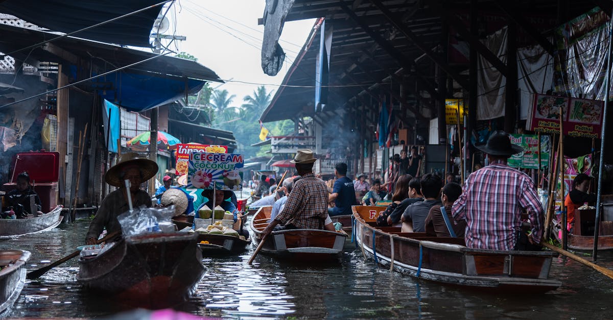 Vibrant floating market with boats full of people shopping and trading goods.