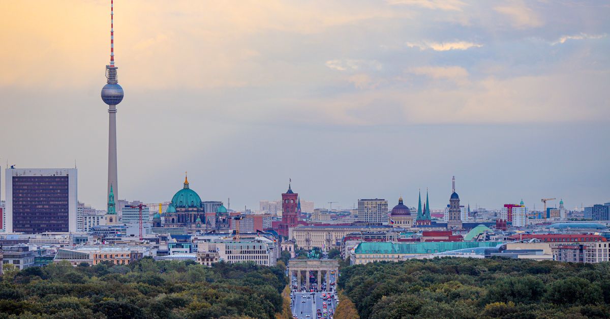 A breathtaking view of Berlin's skyline with the Fernsehturm and Brandenburg Gate.