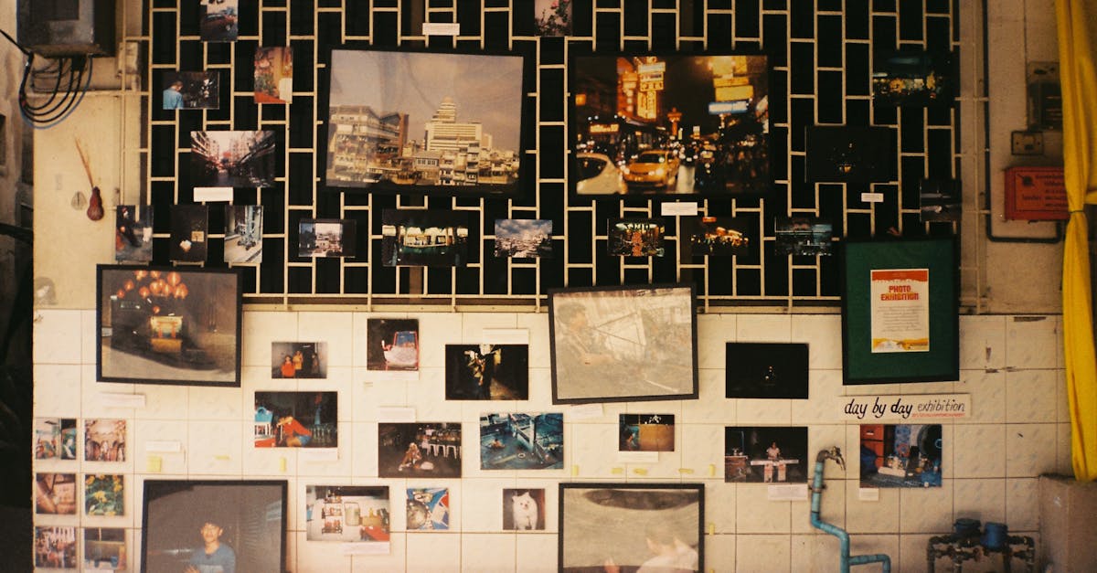 A colorful display of framed photos on a wall at an exhibition in Bangkok, Thailand.