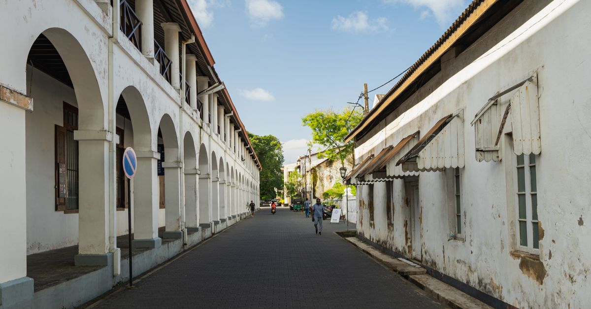 Charming view of a historic street in Galle Fort, Sri Lanka, showcasing colonial architecture and a serene urban environment.