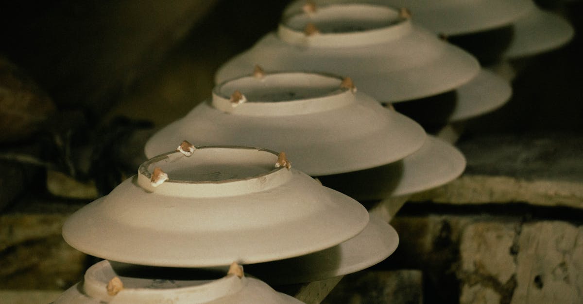 Clay bowls stacked in a pottery studio, showcasing the art of ceramics.