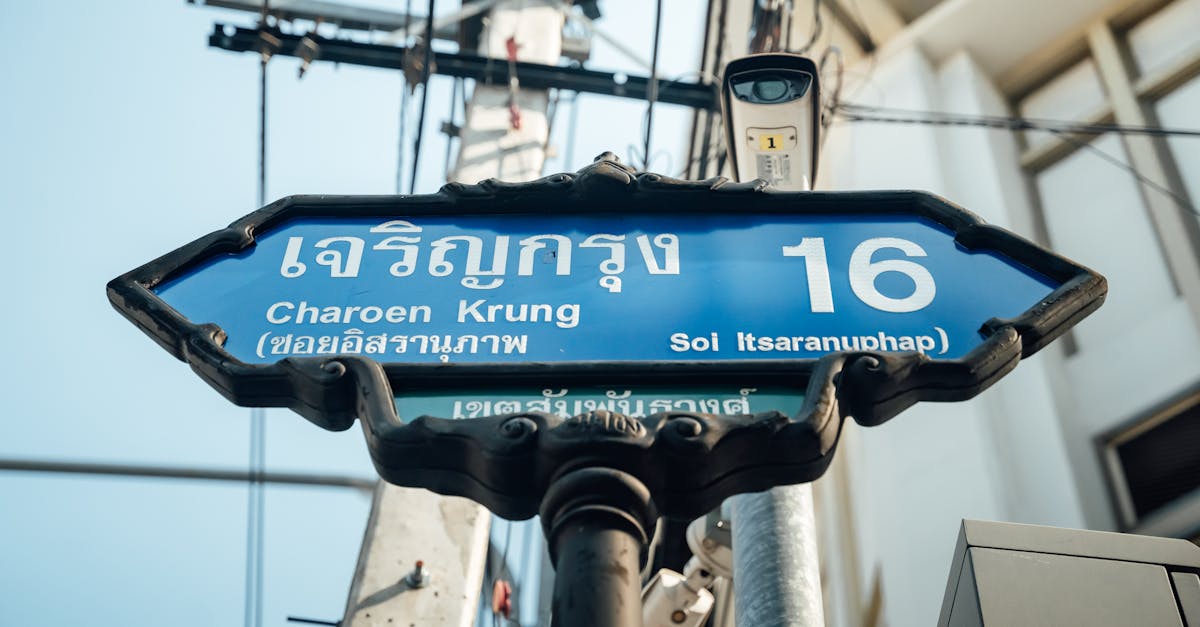 A classic street sign marking Soi Itsaranuphap on Charoen Krung Road in Bangkok, Thailand.