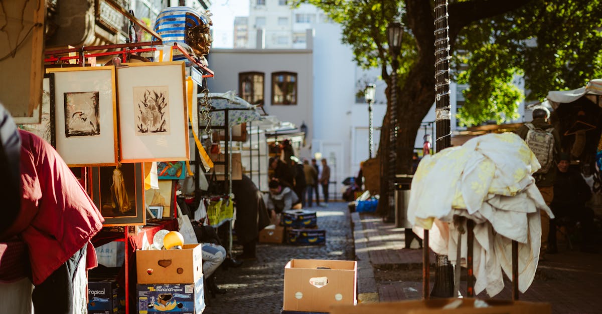 A bustling outdoor street market in Buenos Aires with art and goods on display.