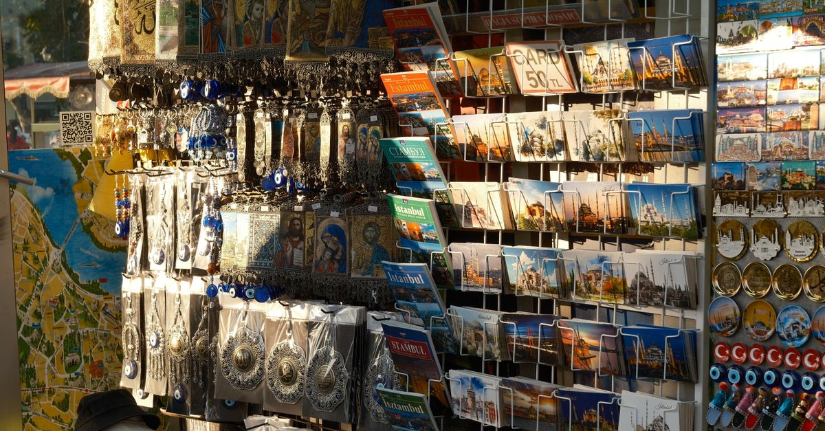 Colorful souvenir shop in Istanbul showcasing postcards and items with cultural motifs.