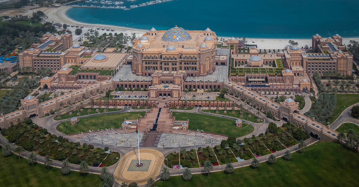 A breathtaking aerial view of the majestic Emirates Palace in Abu Dhabi, overlooking the Arabian Gulf.