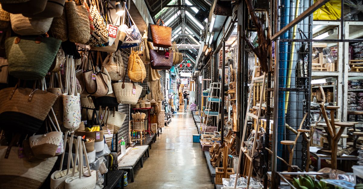 Explore the vibrant and busy Chatuchak Weekend Market in Bangkok; perfect for shopping enthusiasts.