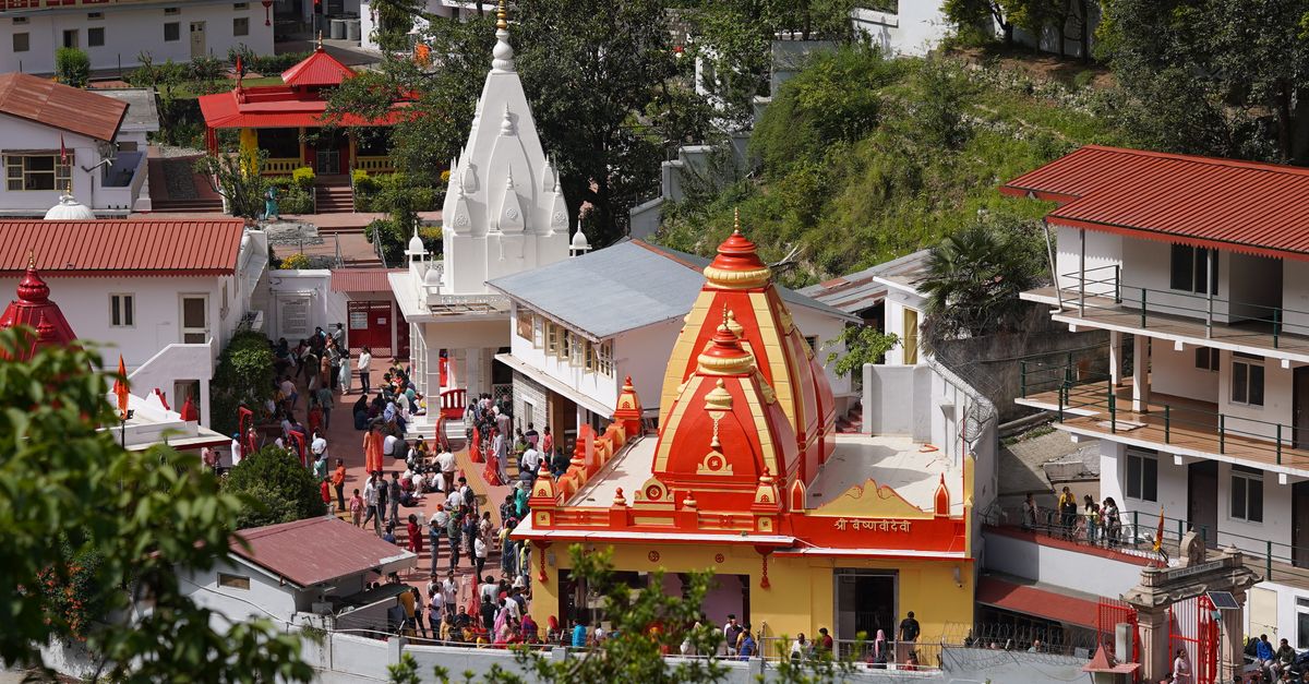 A lively aerial view of Kainchi Dham temple complex capturing its vibrant architecture and bustling activity.