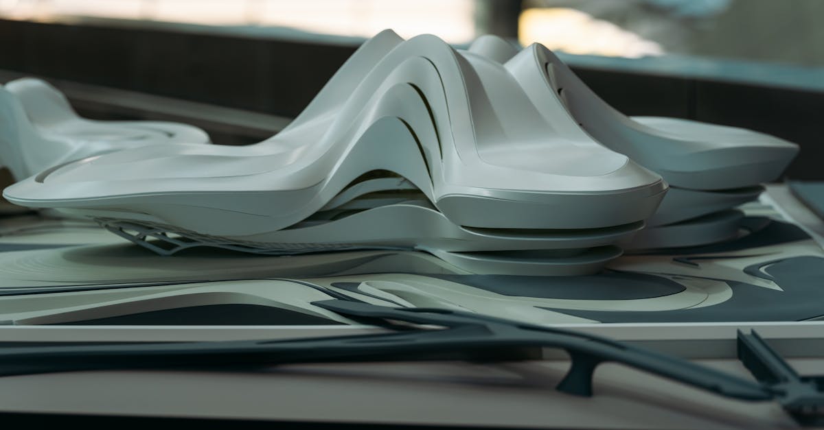 A modern architectural model with sleek curves, showcasing futuristic design elements.