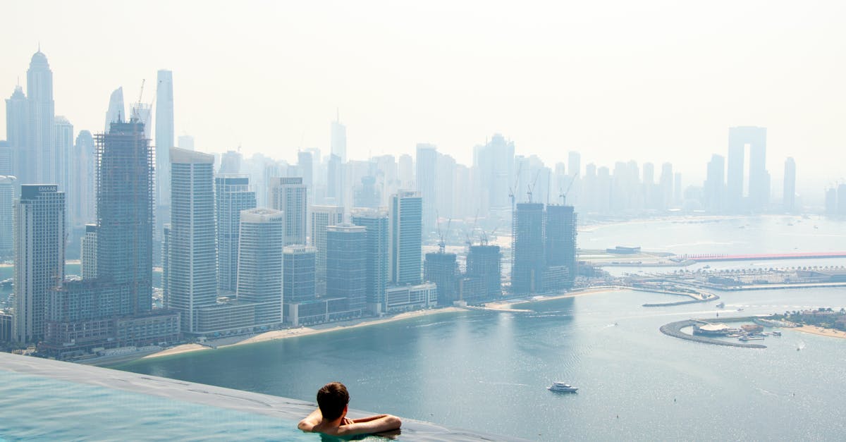 A serene moment in an infinity pool with a stunning view of Dubai's skyline.