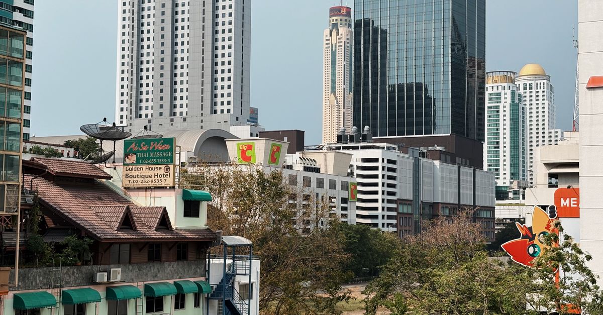 A cityscape of Bangkok with modern skyscrapers and traditional architecture, capturing the urban essence.
