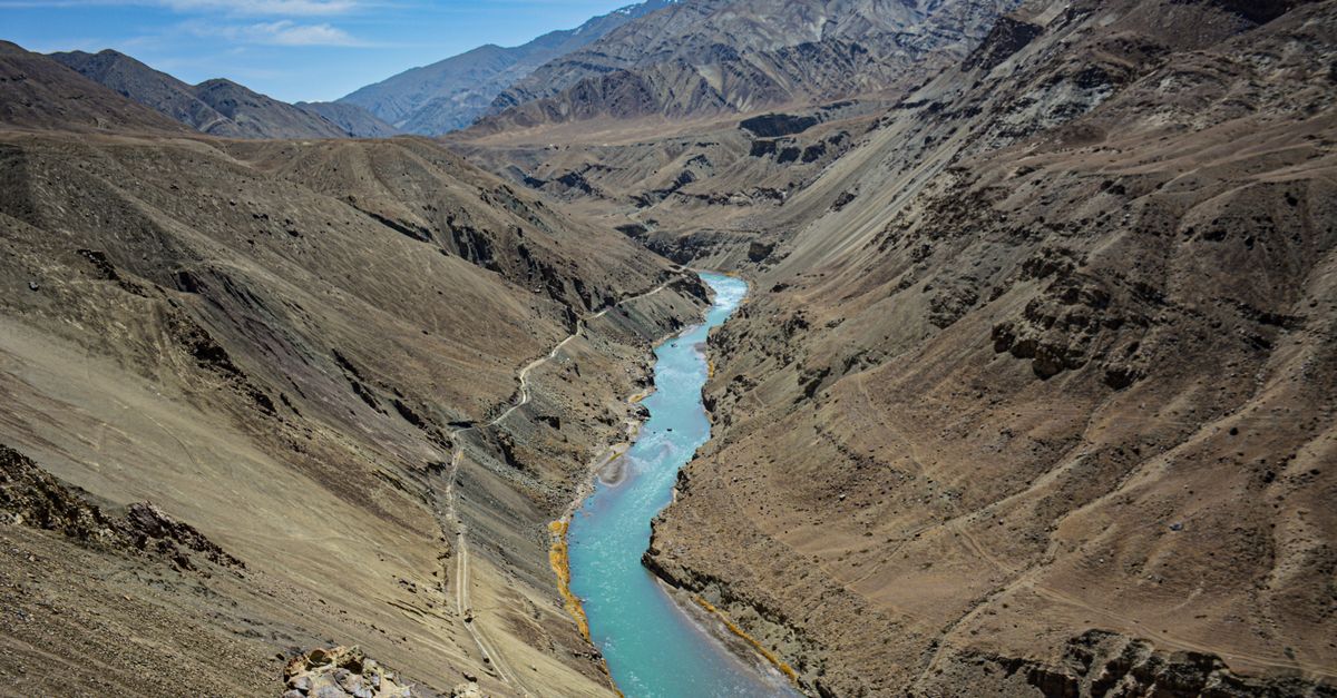 Breathtaking view of the Zanskar River winding through the rugged mountain terrain of Ladakh, India.