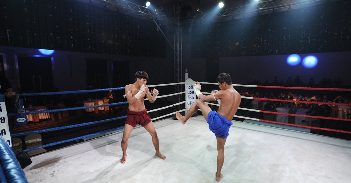 Two Muay Thai fighters engage in an intense match in Pattaya City, Thailand.