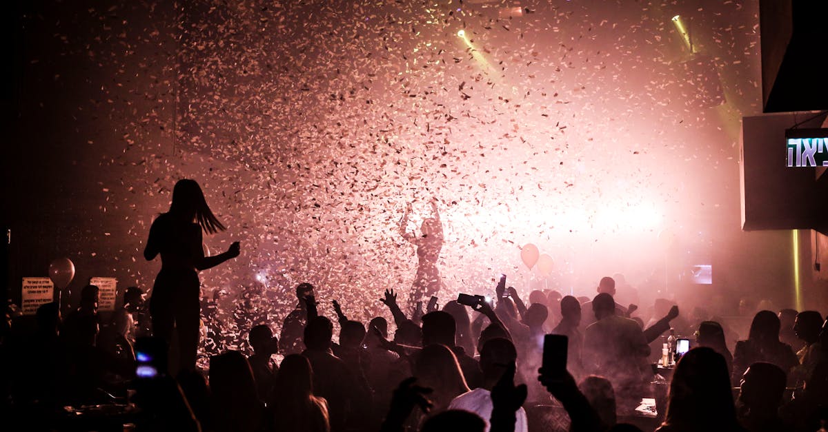 A lively nightclub scene with a crowd celebrating amidst colorful confetti.