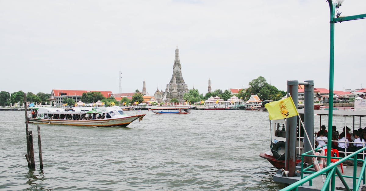 Explore the bustling river life with Wat Arun in the background, capturing Bangkok's cultural essence.