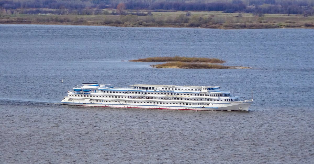 A large cruise ship sails on the Volga River near Nizhny Novgorod, Russia, showcasing tranquil travel.