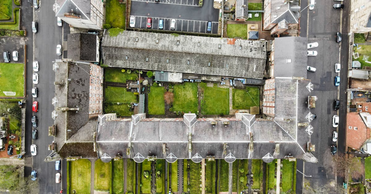 Aerial view of historic buildings and streets in Greenock, Scotland, showcasing unique architecture.