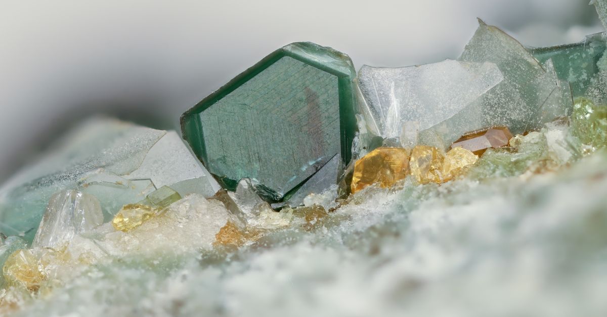 Detailed shot of translucent gemstone crystals with vibrant colors and intricate texture.